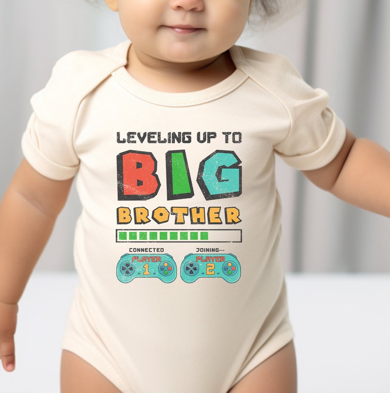 a baby wearing a bodysuit that says, leveling up to big brother