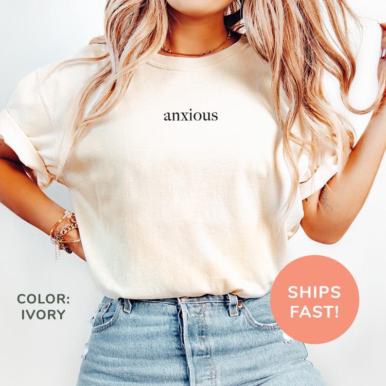 a woman wearing a t - shirt that says anxious