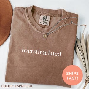 a t - shirt with the words oversimulated printed on it