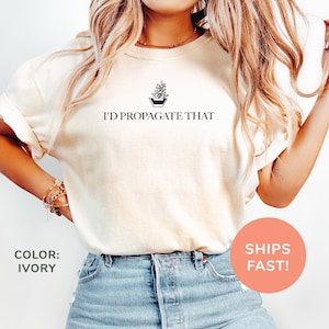 a woman wearing a t - shirt that says i'd propagate that