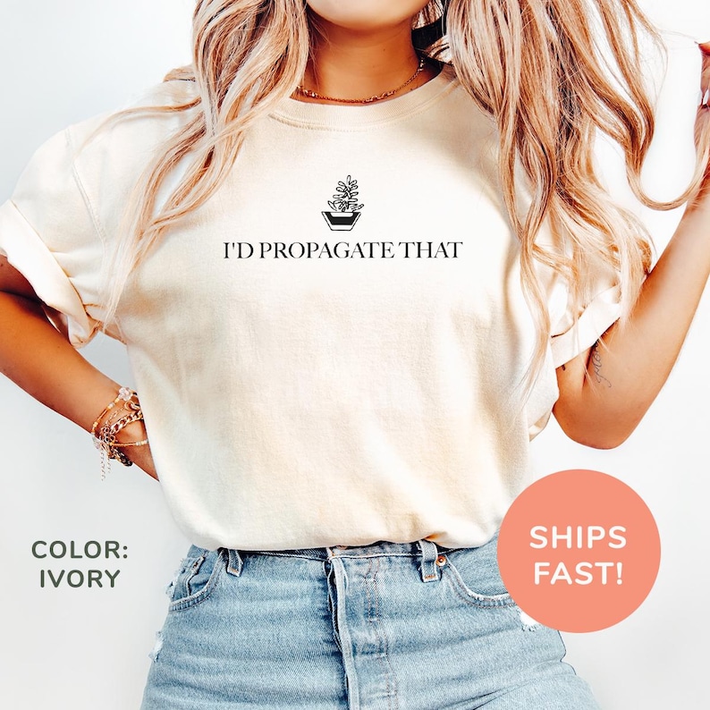 a woman wearing a t - shirt that says i'd propagate that