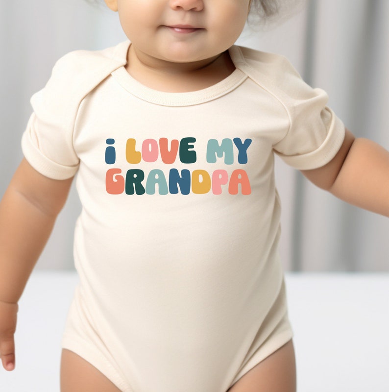 a baby wearing a bodysuit that says i love my grandpaa