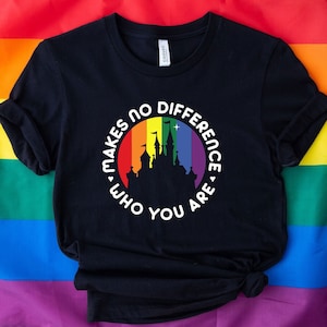 May include: Black t-shirt with a rainbow circle and a silhouette of a castle. The text inside the circle reads "It makes no difference who you are."