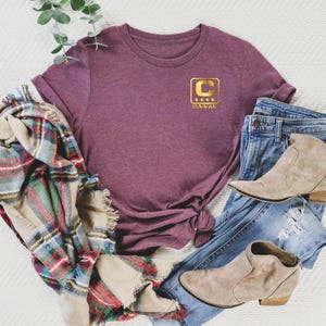 a pile of clothing and shoes on a white surface