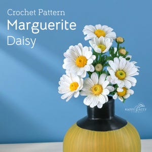 May include: A crochet pattern for Marguerite Daisy flowers. The image shows a bouquet of white daisies with yellow centres in a yellow and black vase. The text "Crochet Pattern Marguerite Daisy" is at the top.