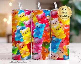 May include: Three colorful tumblers with a gummy bear design. The tumblers are made of stainless steel and have a clear plastic lid. The design features a variety of colors, including pink, blue, yellow, green, and orange. The tumblers are perfect for holding cold beverages.