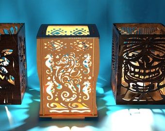 May include: Three wooden candle holders with intricate cut-out designs. The first holder features a floral design, the second has a seahorse design, and the third has a tiki face design.