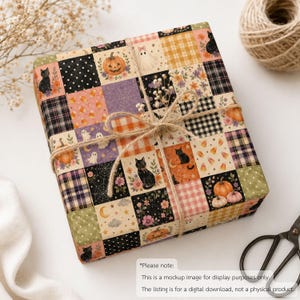 May include: A square gift box wrapped in paper with a patchwork design featuring Halloween motifs including black cats, pumpkins, ghosts, candy corn, spider webs, and floral patterns in orange, black, purple, and cream, tied with natural jute twine.