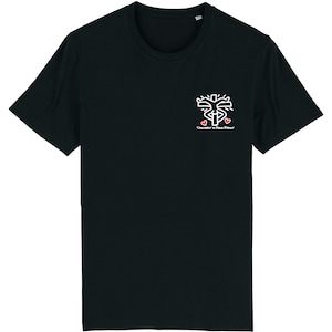 May include: Black t-shirt with a white graphic of a stylized cross with two red hearts and the text "Consid&eacute;rer le Bien D'autrui".