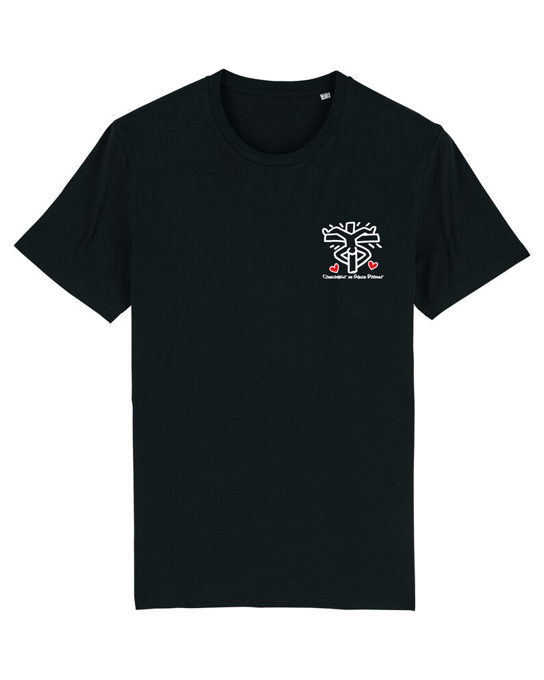 May include: Black t-shirt with a white graphic of a stylized cross with two red hearts and the text "Consid&eacute;rer le Bien D'autrui".