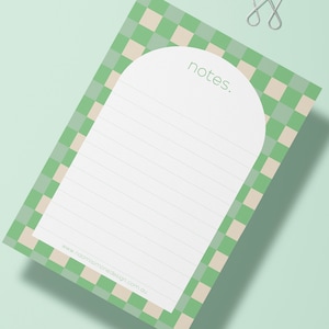 May include: Green and beige checkered notepad with a rounded top and lined writing area. The notepad has the word "notes." printed in green at the top and the website "www.naomisimonedesign.com.au" printed at the bottom.