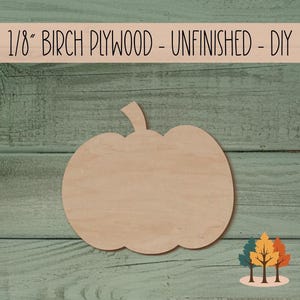 May include: Unfinished 1/8 inch thick birch plywood pumpkin shape. The pumpkin is on a green wooden background.