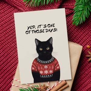 Carte de Noël de chat mignon. Chat avec pull de Noël norvégien. Jeu de cartes de vœux drôles de chat noir.