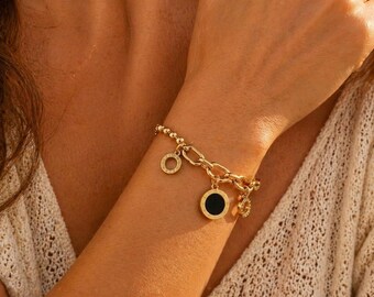 Gold-tone women's bracelet with black charms and circles, chic modern minimalist bracelet, trendy stainless steel jewelry, elegant gift for women