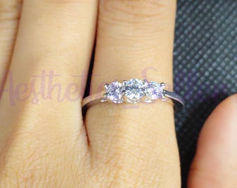Moissanite Three Stone Ring: 10K White Gold Trilogy Engagement Ring