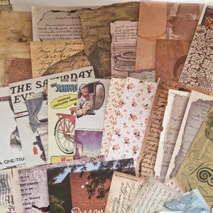 Op de afbeelding: Een verzameling vintage ephemera, waaronder verouderd papier, handgeschreven brieven en tijdschriftknipsels. Het assortiment bevat verschillende kleuren, texturen en ontwerpen, waardoor een nostalgische esthetiek ontstaat. Sommige stukken hebben zichtbare tekst en illustraties.