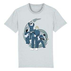 May include: Light gray t-shirt featuring a stylized illustration of a band. The band members are depicted in blue, playing guitars and other instruments against a swirling gray background. The t-shirt has a crew neck and short sleeves.