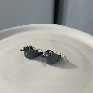 Pigeon dangle earrings