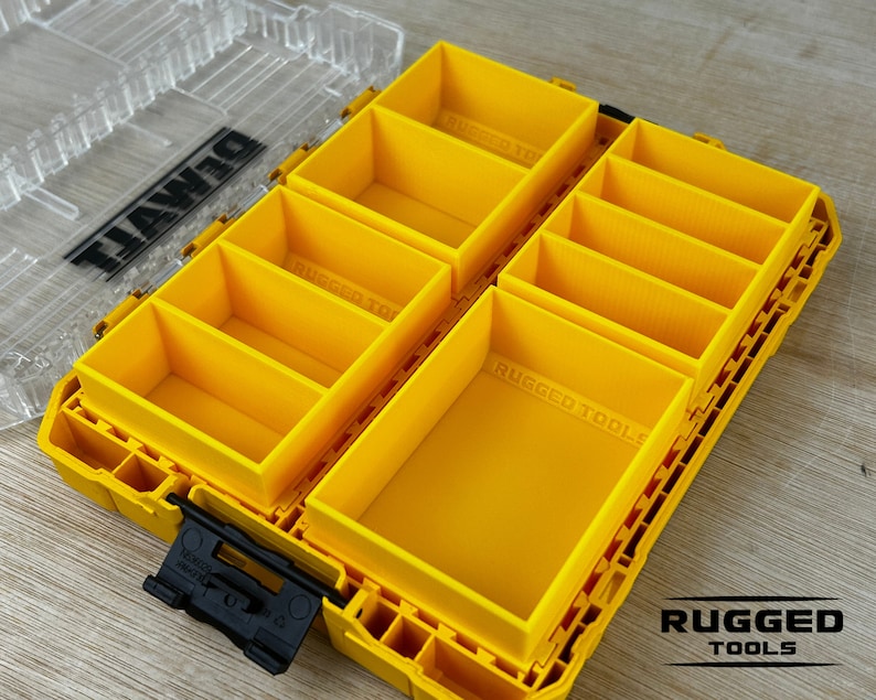 May include: Yellow plastic storage box with multiple compartments. The box is labeled "DEWALT" and "RUGGED TOOLS".