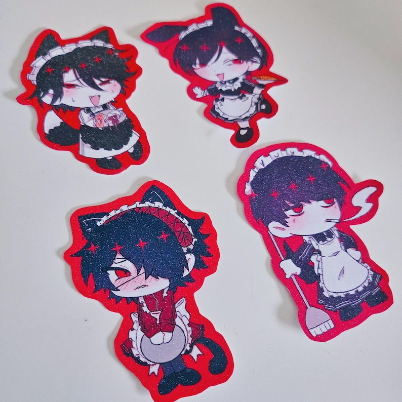 May include: Four red stickers featuring anime-style characters in maid outfits. Each sticker has a black-haired character with red eyes and a white apron. The characters are in different poses, some with cat ears or bunny ears.