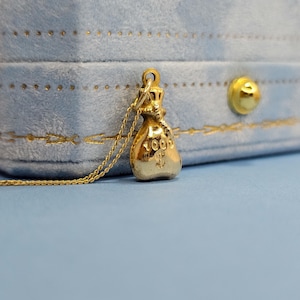 Ciondolo a forma di sacco porta soldi in oro massiccio 9k Mini Treasures in oro giallo 9 ct 375