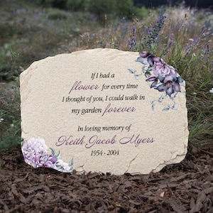 May include: A beige stone garden memorial with floral accents. The inscription reads, "If I had a flower for every time I thought of you, I could walk in my garden forever. In loving memory of Keith Jacob Myers 1954-2004."
