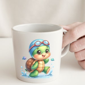 May include: A white ceramic mug with a cartoon illustration of a turtle wearing blue swimming goggles and a blue swim cap. The turtle is walking on a blue and white wave pattern. The turtle is brown, green, and yellow. There are two small blue and purple fish in the background.