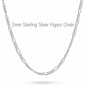 2mm sterling silver figaro chain necklace on a white background, a light everyday chain for a pendant