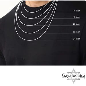 May include: A black shirt with white lines illustrating necklace lengths: 16, 18, 20, 22, and 24 inches. The Gaya Judaica jewelry logo is at the bottom. This image is for jewelry product display.