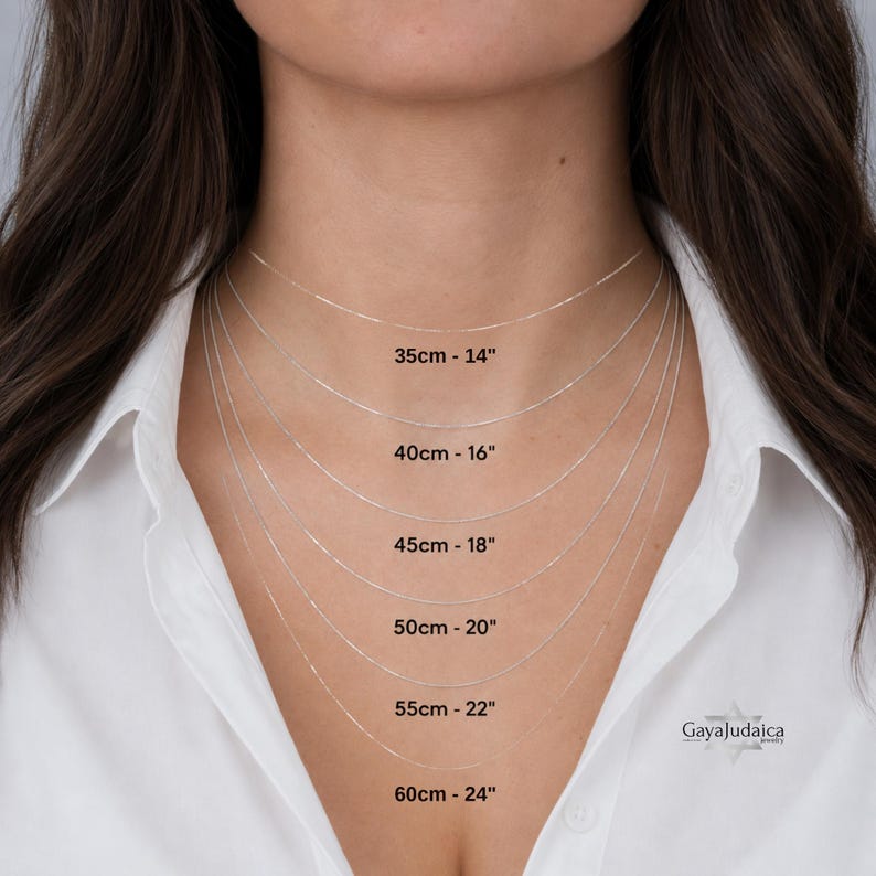 Necklace chain length guide on a woman showing 14 to 24 inch sterling silver chains marked in cm and inches