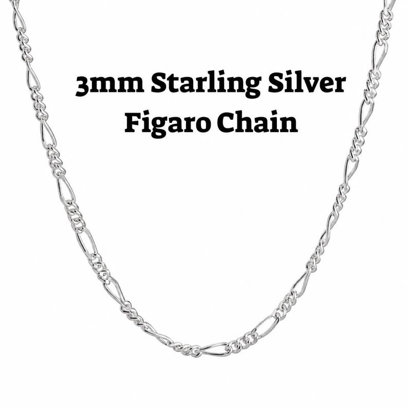 3mm sterling silver figaro chain necklace on a white background with alternating long and short links