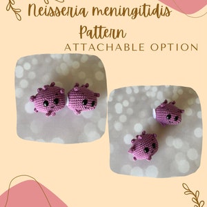 May include: Two crocheted purple Neisseria meningitidis bacteria with smiling faces. The pattern is attachable, as shown in the image. The image includes the text "Neisseria meningitidis Pattern Attachable Option".