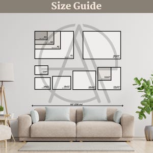 a living room with a couch and a wall with a picture frame
