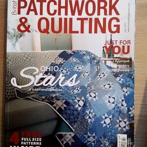 May include: A magazine cover for British Patchwork & Quilting, featuring a quilt with a blue and white star pattern. The cover text reads "Ohio Stars" and "Just for You".