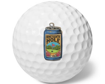 May include: White golf ball with a blue can illustration. The can features the text "Nineteenth Hole" with a golf course scene. The can has a pull-tab and is decorated with flowers.