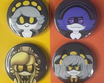 May include: Four round buttons with cartoon character designs. Each button features a different character with a black background. The characters have yellow and gray accents, with various hairstyles and expressions. The buttons are arranged on a yellow and orange background.