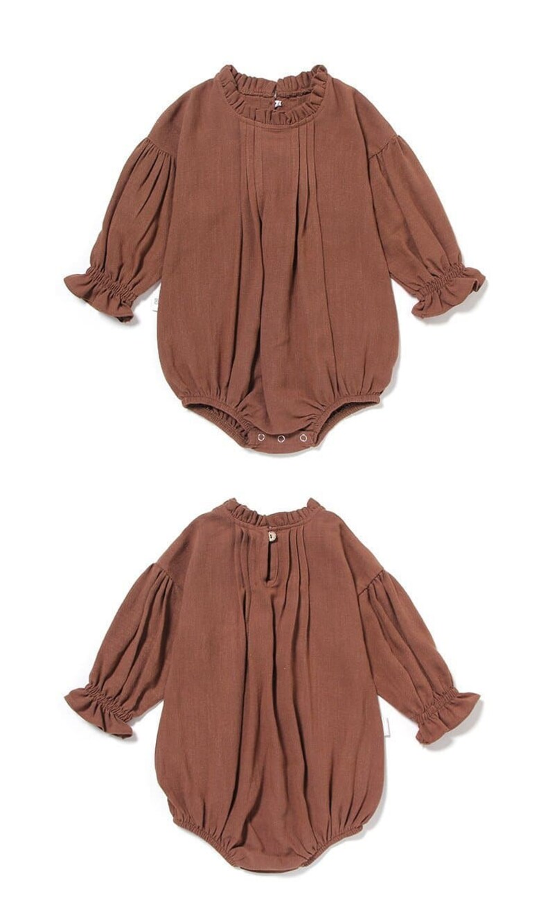May include: A brown baby onesie with long sleeves and a ruffled neckline. The onesie has a gathered skirt and is made of a soft, comfortable fabric.