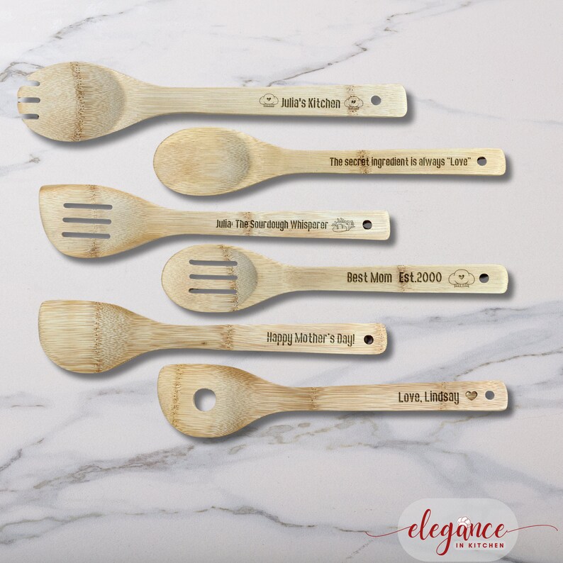 four wooden spoons with engraved names on them