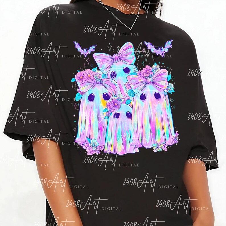 a black t-shirt with a colorful graphic design depicting three ghostly, bow-wearing figures surrounded by flowers and bats.