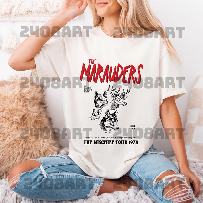 a woman sitting on a bed wearing a t - shirt