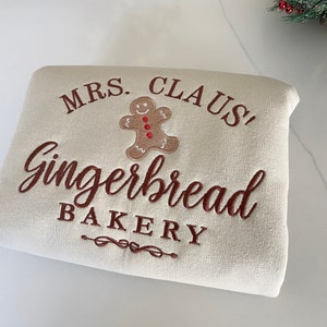 Mrs. Claus&#39;s Gingerbread Bakery Embroidered Unisex Cotton and polyester blend Christmas Themed Crewneck  Sweatshirt