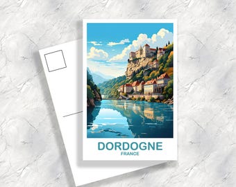 May include: A postcard featuring a colorful illustration of a town in Dordogne, France. The town is built on a cliff overlooking a river. The postcard has the text "Dordogne, France" printed on it.