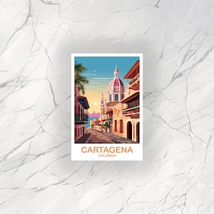 May include: A postcard illustration of a street scene in Cartagena, Colombia. The street is lined with colorful buildings, and there is a large church in the background. The sky is blue and there are palm trees on either side of the street. The text on the postcard reads 'Cartagena, Colombia'.