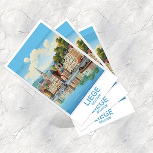 May include: A stack of three postcards featuring a scenic illustration of Li&egrave;ge, Belgium. The artwork depicts a waterside cityscape with buildings, a church spire, and a blue sky. The postcards have the text "LIEGE BELGIUM" in a light blue font.