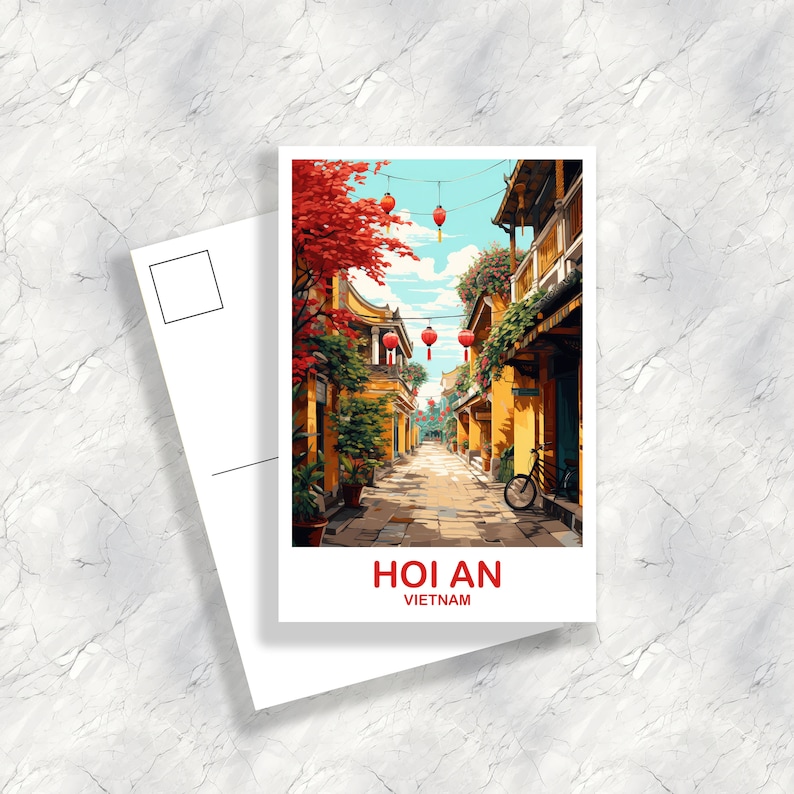 May include: A postcard featuring a colorful illustration of a narrow street in Hoi An, Vietnam. The street is lined with yellow buildings and lush greenery. Red lanterns hang from wires overhead. The text "Hoi An, Vietnam" is printed at the bottom of the postcard.