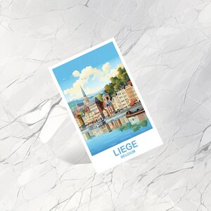 May include: A white rectangular print featuring a colorful illustration of a European city with a river and buildings. The print has the text "LIEGE" and "BELGIUM" in blue at the bottom.