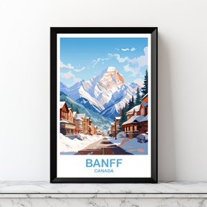 May include: A vintage-style travel poster featuring a snowy mountain scene with a town in the foreground. The poster reads "BANFF CANADA" in blue text.