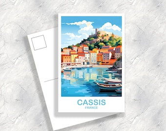 May include: A postcard featuring a colorful illustration of the town of Cassis, France. The postcard shows a harbor with boats and a hillside town with buildings in shades of yellow, orange, red, and green. The text "Cassis, France" is printed at the bottom of the postcard.