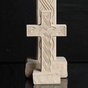 Catholic standing cross made of limestone  Croatian Interlace Design