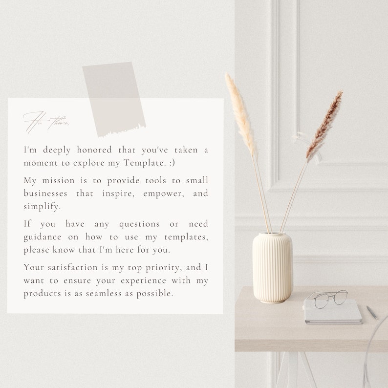 May include: A white card with a message about providing tools for small businesses. The card is on a wooden table with a white vase containing dried pampas grass and a pair of glasses.